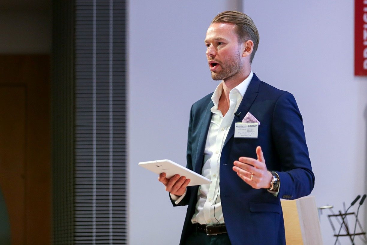 alex-harrington-griffin-holding-tablet